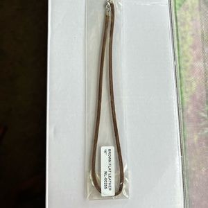 Brown leather necklace cord.